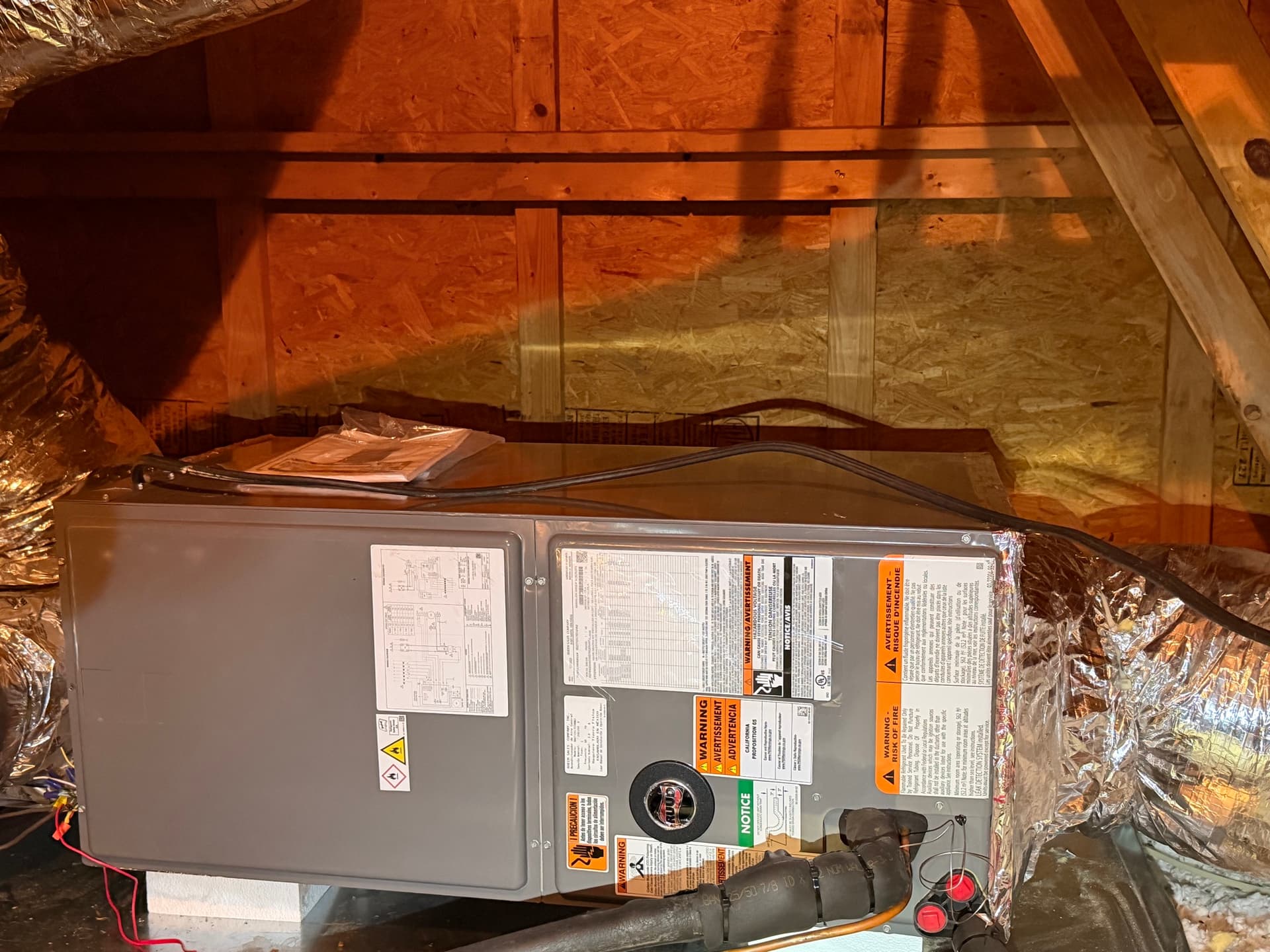 Ruud furnace in an attic — heating repair and tune-ups across the Upstate