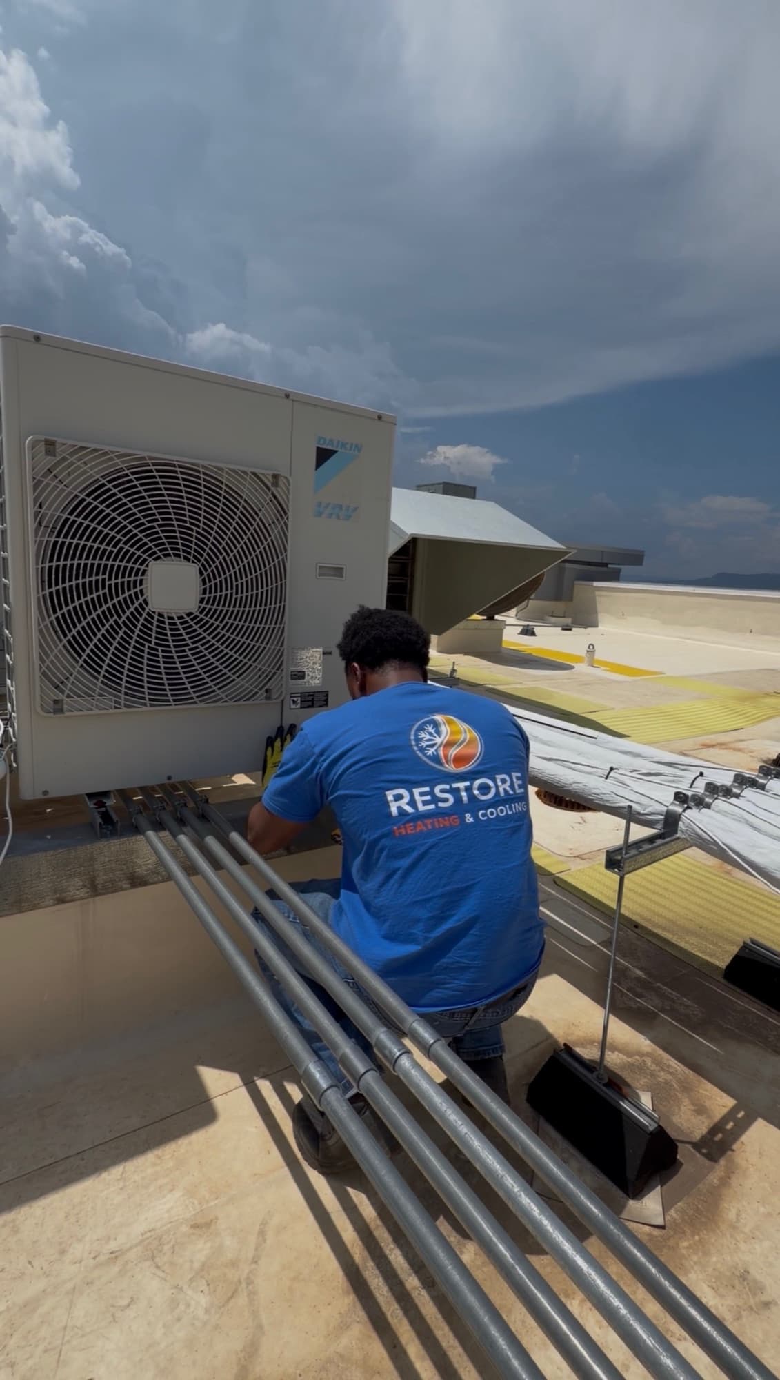 Restore tech performing commercial HVAC maintenance