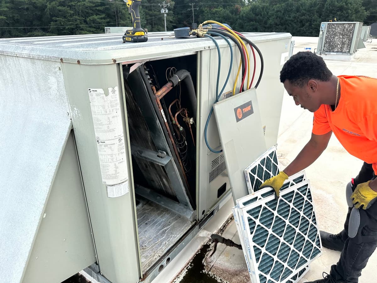 Technician servicing equipment on site
