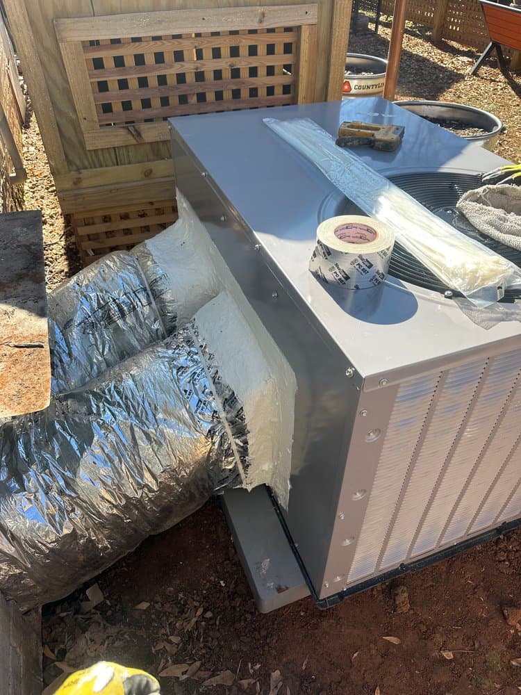 Restore HVAC technician servicing equipment